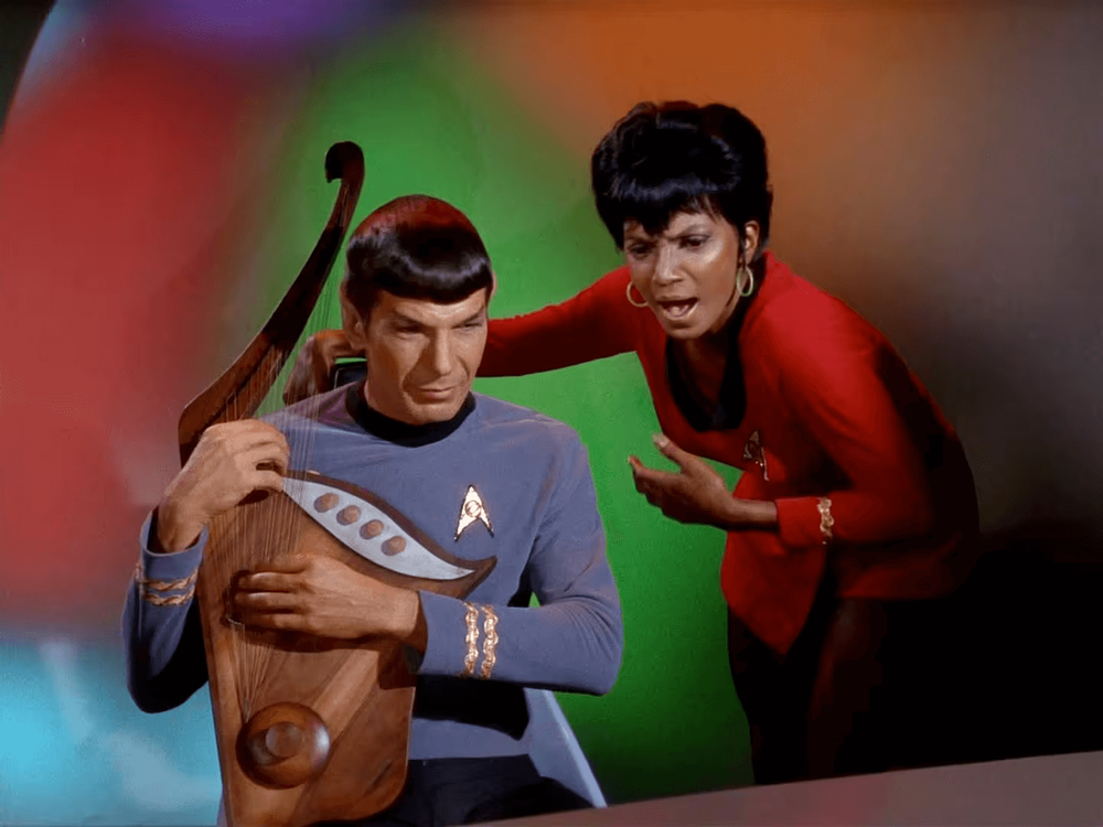 https://mediaproxy.tvtropes.org/width/1000/https://static.tvtropes.org/pmwiki/pub/images/spock_playing_harp_and_uhura_singing.png