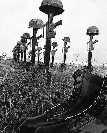 sticking out of wwii soldier with rifle boots helmet